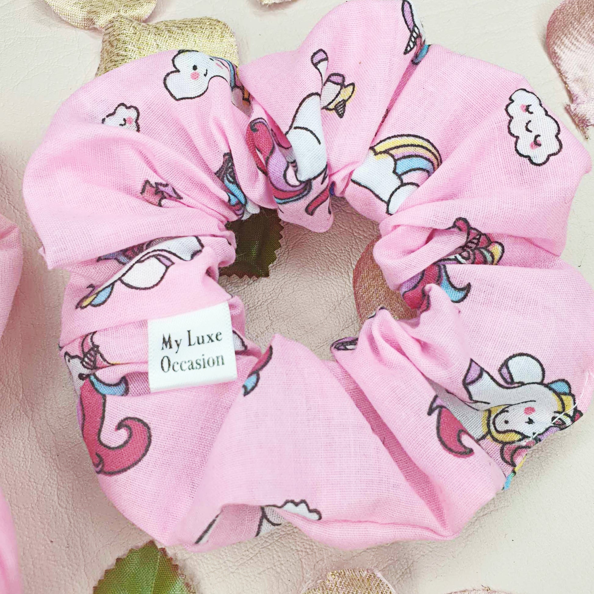 Add a touch of magic to your hair with our Pink Unicorn Scrunchie! Handmade by MyLuxeOccasion