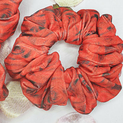 Add a touch of boldness to your hair with our Red and Black Roses Scrunchie! Handmade by myluxeoccasion, this scrunchie guarantees no wilted flowers. 